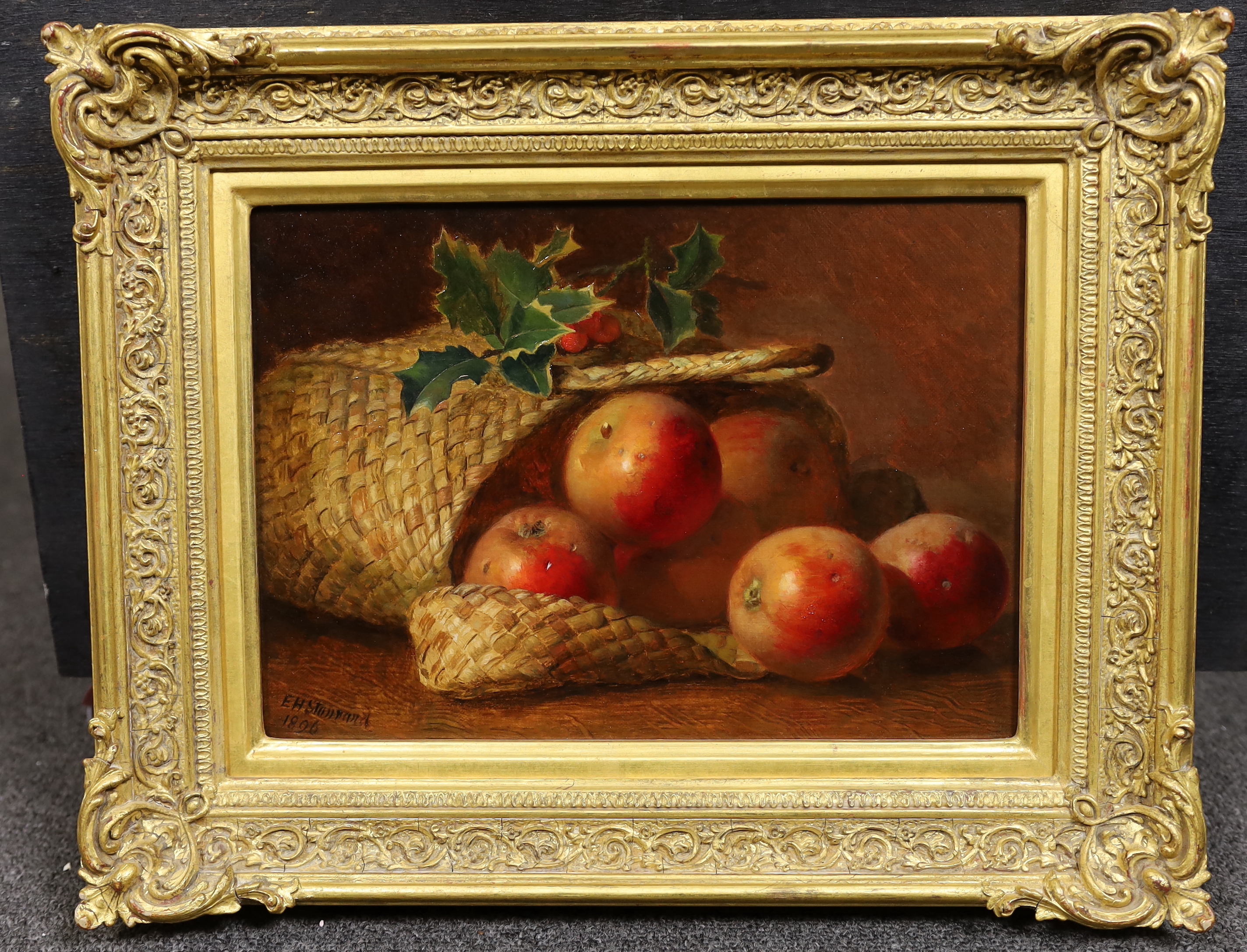 Eloise Harriet Stannard (English, 1829-1915), Still life with apples and holly beside a basket, oil on canvas, 21 x 29cm